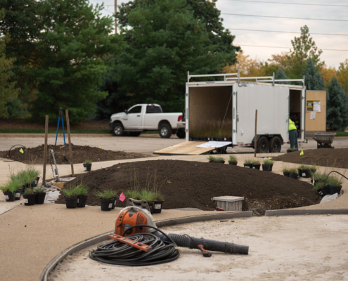 Commercial Landscaping Truck With Equipment In Foreground